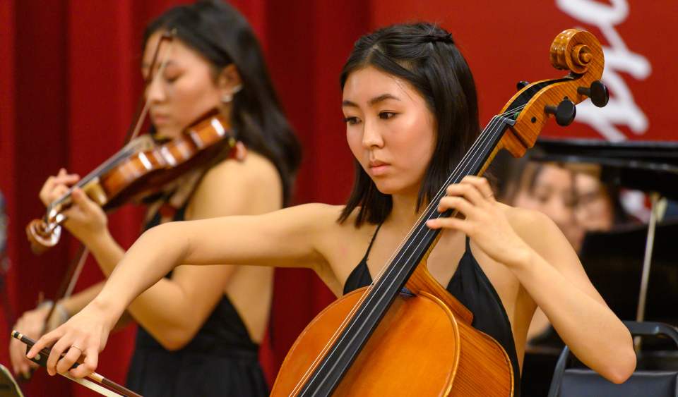 Taylor Yoon Playing the cello