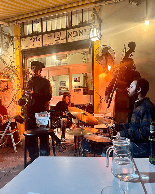 Ran Shinar and friends perform a set of classic and modern jazz outside the Jaffa Cafe on a small streetfront just south of Tel Aviv.